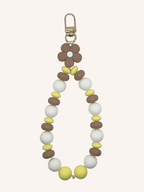 Chaine de téléphone fleur brune & perles jaune beurre