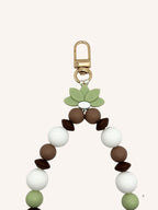 Chaine de téléphone chocolat & fleur verte