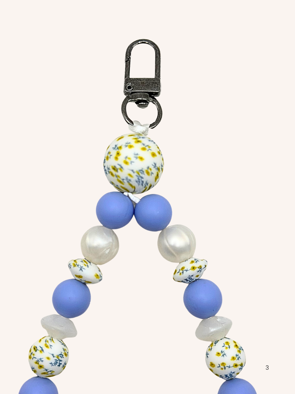 Chaîne de téléphone perles fleuries et bleues