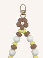 Chaine de téléphone fleur brune & perles jaune beurre