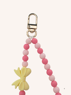 Chaine de téléphone nœud jaune & rose