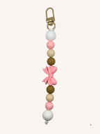 Chaîne de téléphone nœud papillon rose