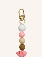 Chaîne de téléphone nœud papillon rose