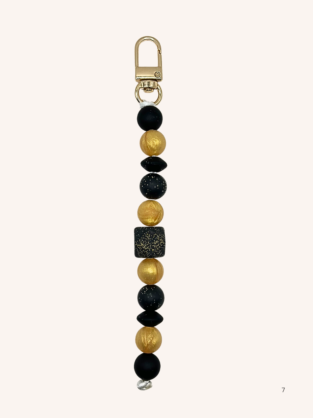 Chaîne de téléphone dorée et noire