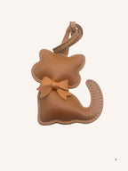 Bijou de sac chat marron