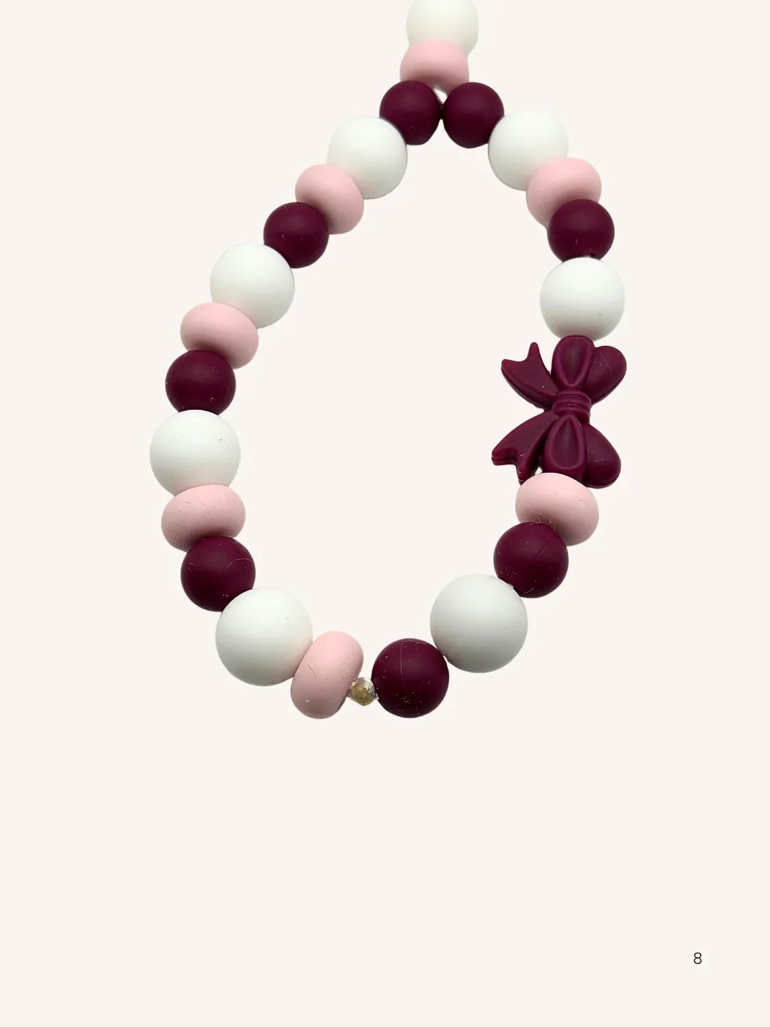 Chaine de téléphone noeud rose
